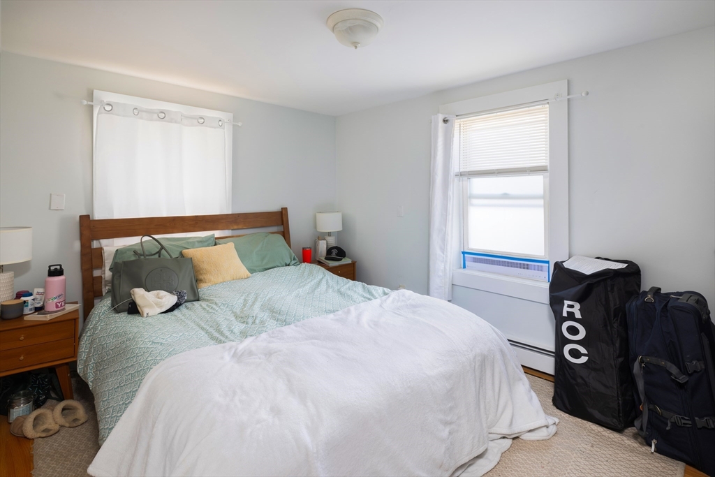 140 Athens Street Boston, MA 02127 - Photo 8 of 11 a bedroom with a bed and window