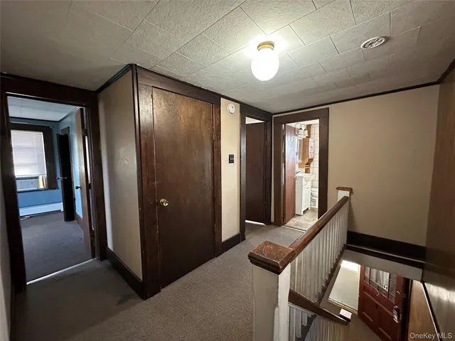 a view of a hallway with workspace