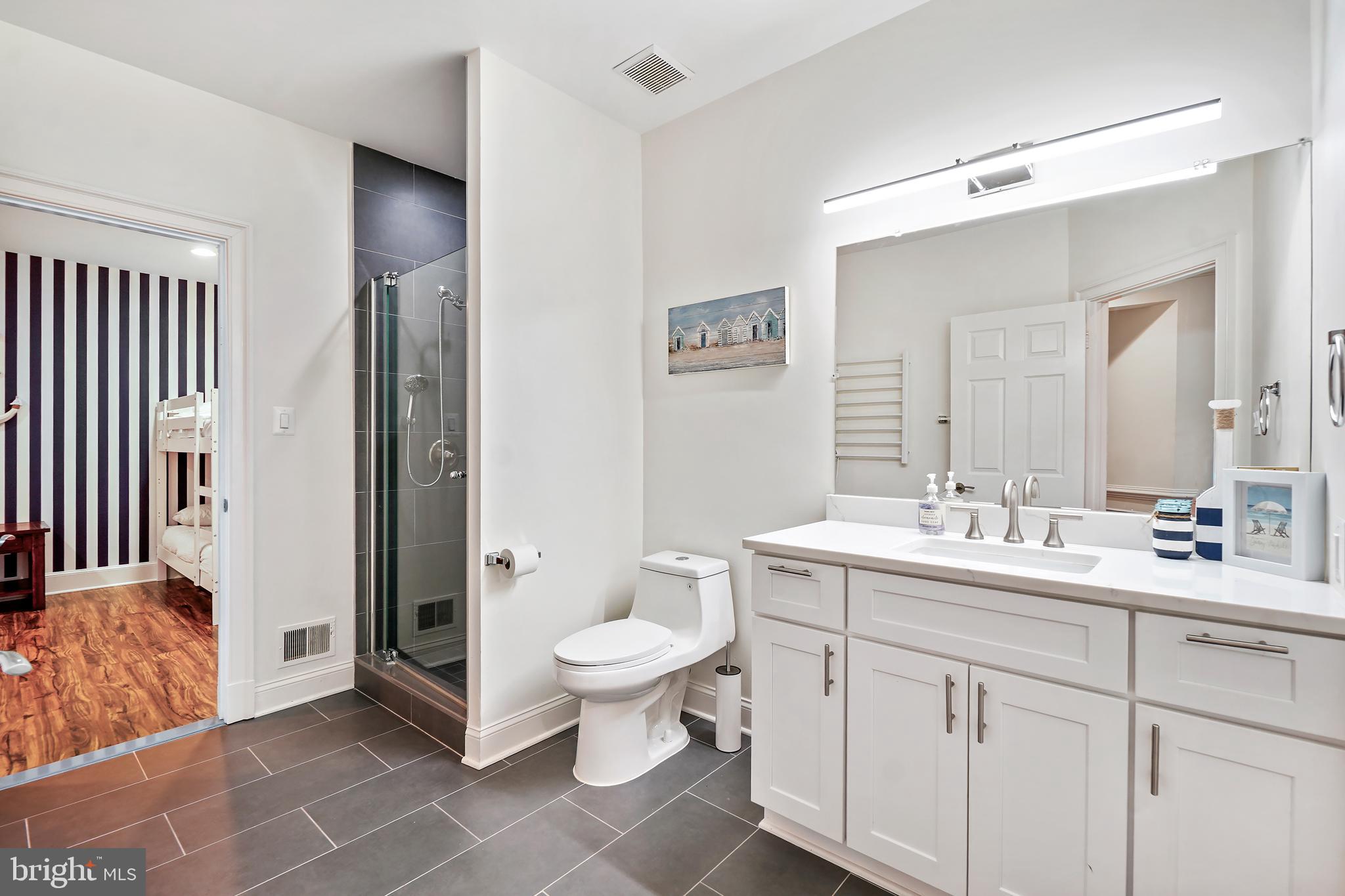 9646 Eagle Ridge Drive Bethesda, MD 20817 - Photo 40 of 75 a spacious bathroom with a double vanity sink toilet and shower