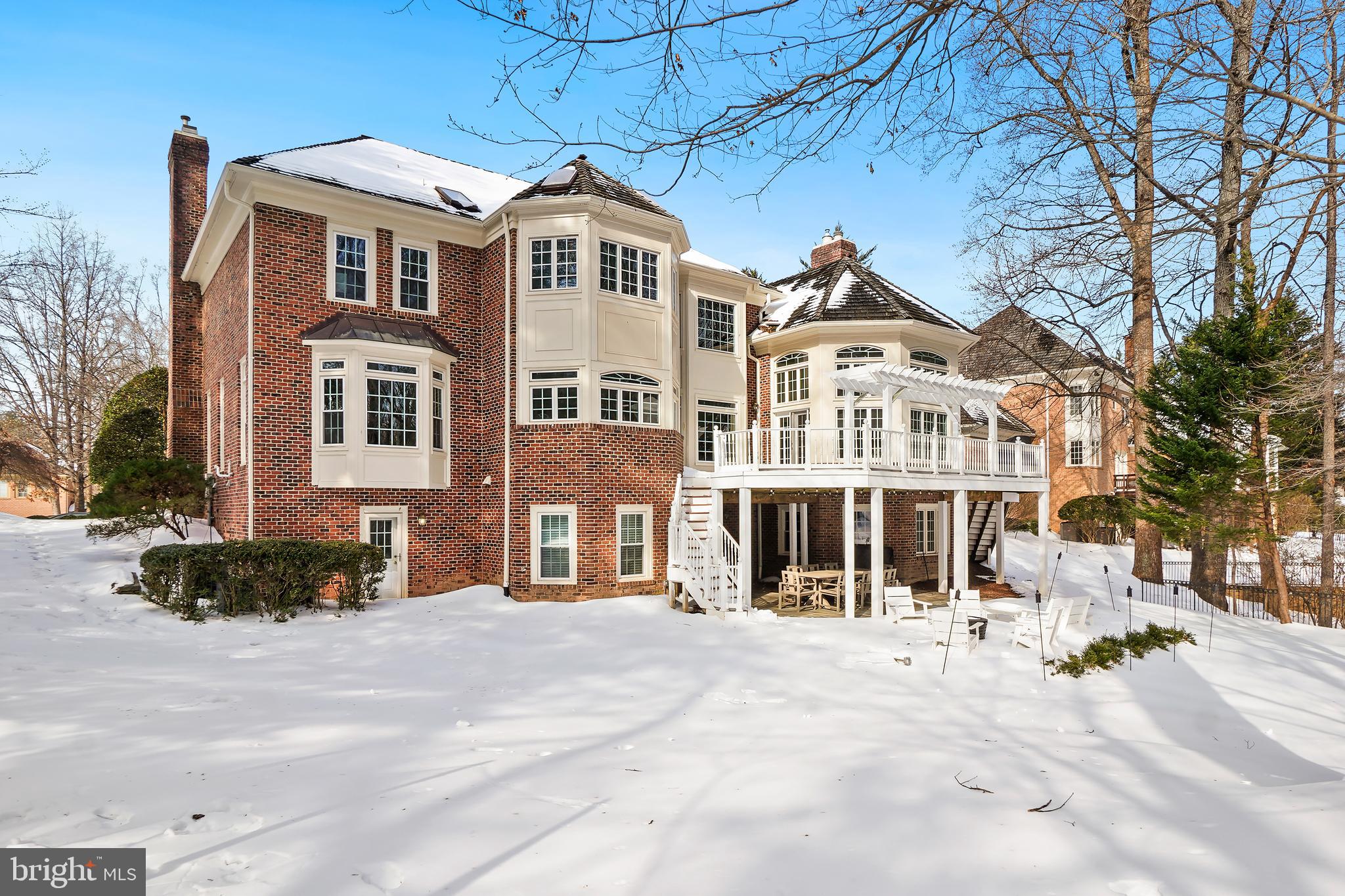 9646 Eagle Ridge Drive Bethesda, MD 20817 - Photo 52 of 75 a front view of a building with a yard