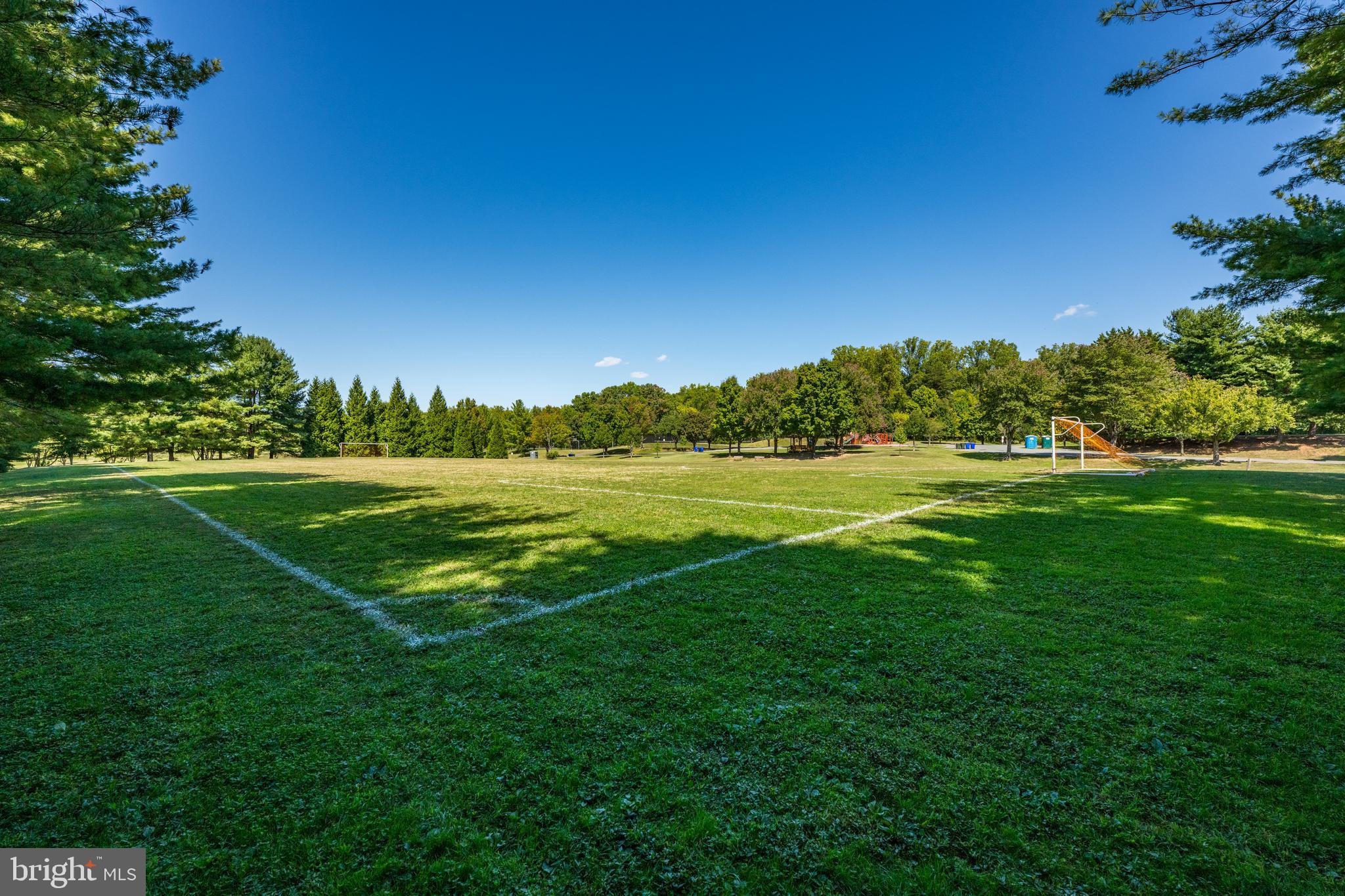 9646 Eagle Ridge Drive Bethesda, MD 20817 - Photo 62 of 75 a view of a golf course with a lake