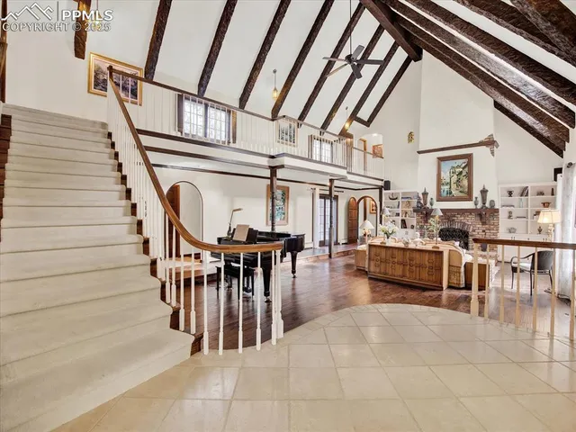 a view of entryway and hall with dining room and stairs