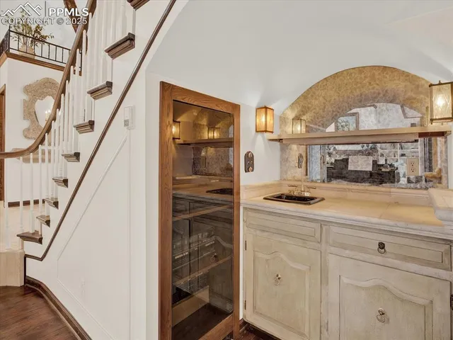 a hallway with a stove a washer and dryer