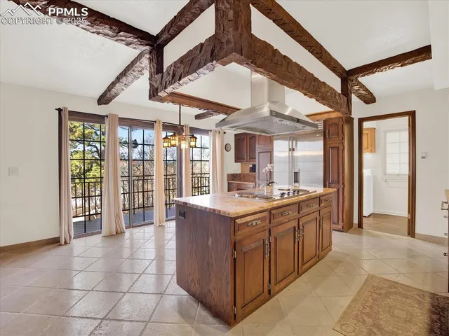 a kitchen with stainless steel appliances granite countertop a sink and cabinets