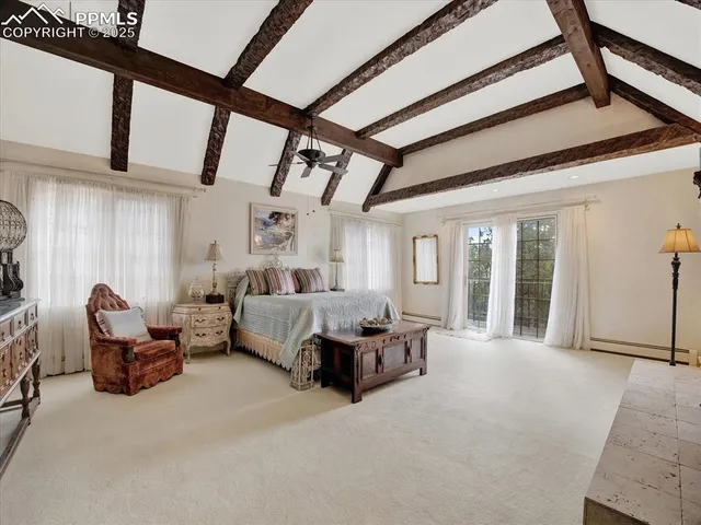 a spacious bedroom with furniture and windows