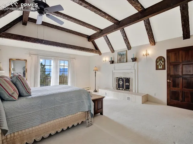 a bedroom with furniture and a fireplace
