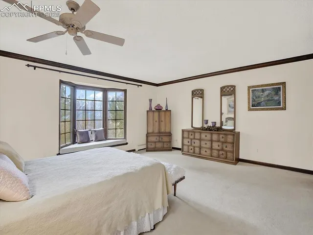 a spacious bedroom with a bed dresser and a window