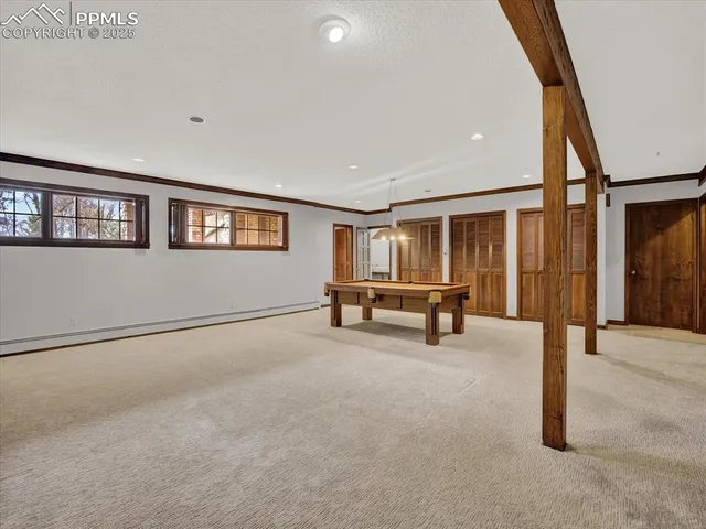 a view of an empty room with windows