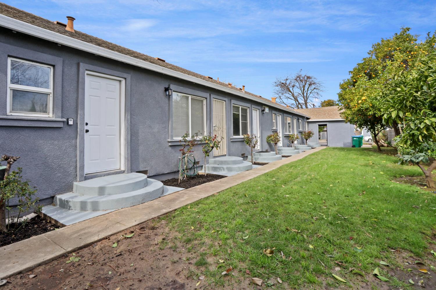 312 Cherry Street Lodi, CA 95240 - Photo 4 of 10 a front view of a house with garden