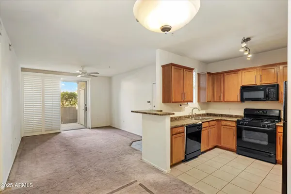 a kitchen with stainless steel appliances granite countertop a stove and a sink