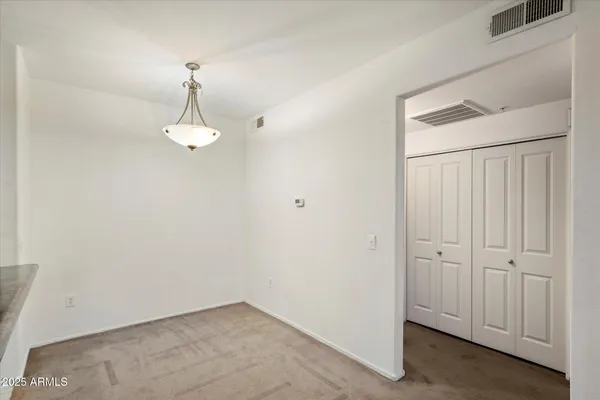 an empty room with a mirror