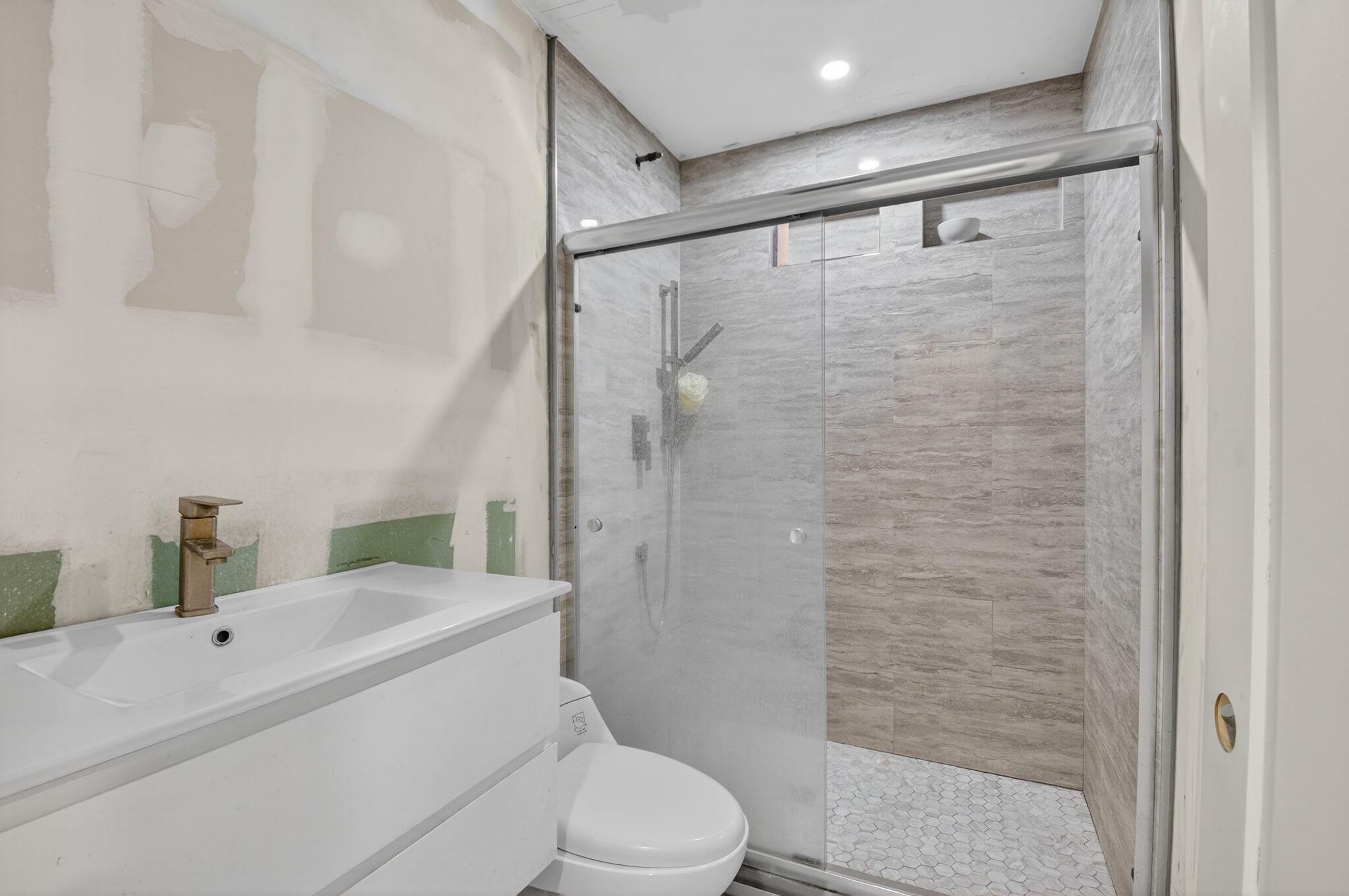 5196 Palm Ridge Boulevard Delray Beach, FL 33484 - Photo 11 of 24 a bathroom with a sink mirror vanity and toilet