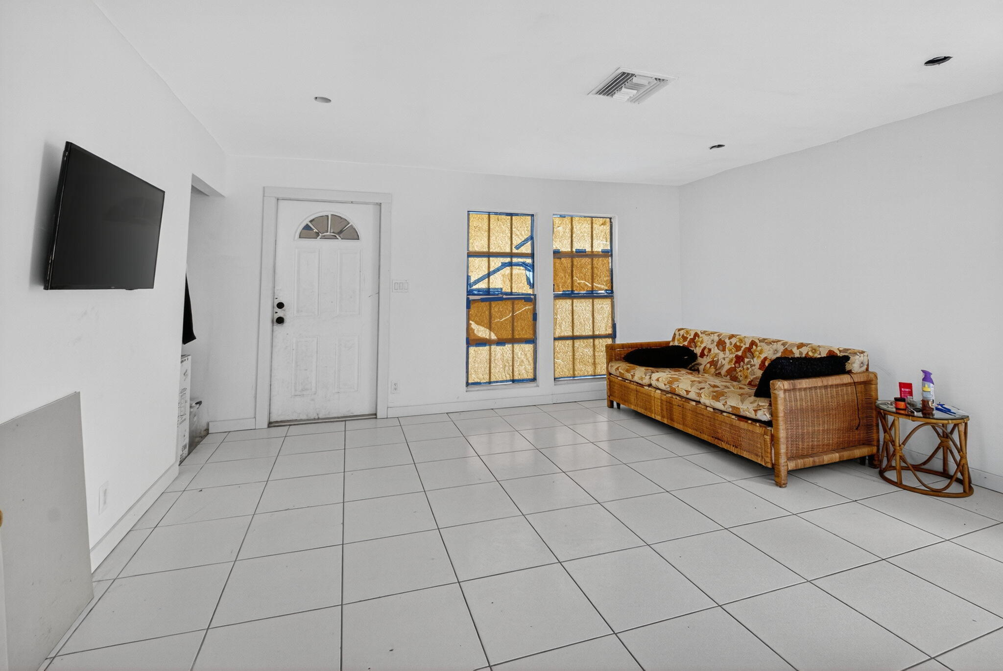 5196 Palm Ridge Boulevard Delray Beach, FL 33484 - Photo 19 of 24 a living room with furniture and a flat screen tv