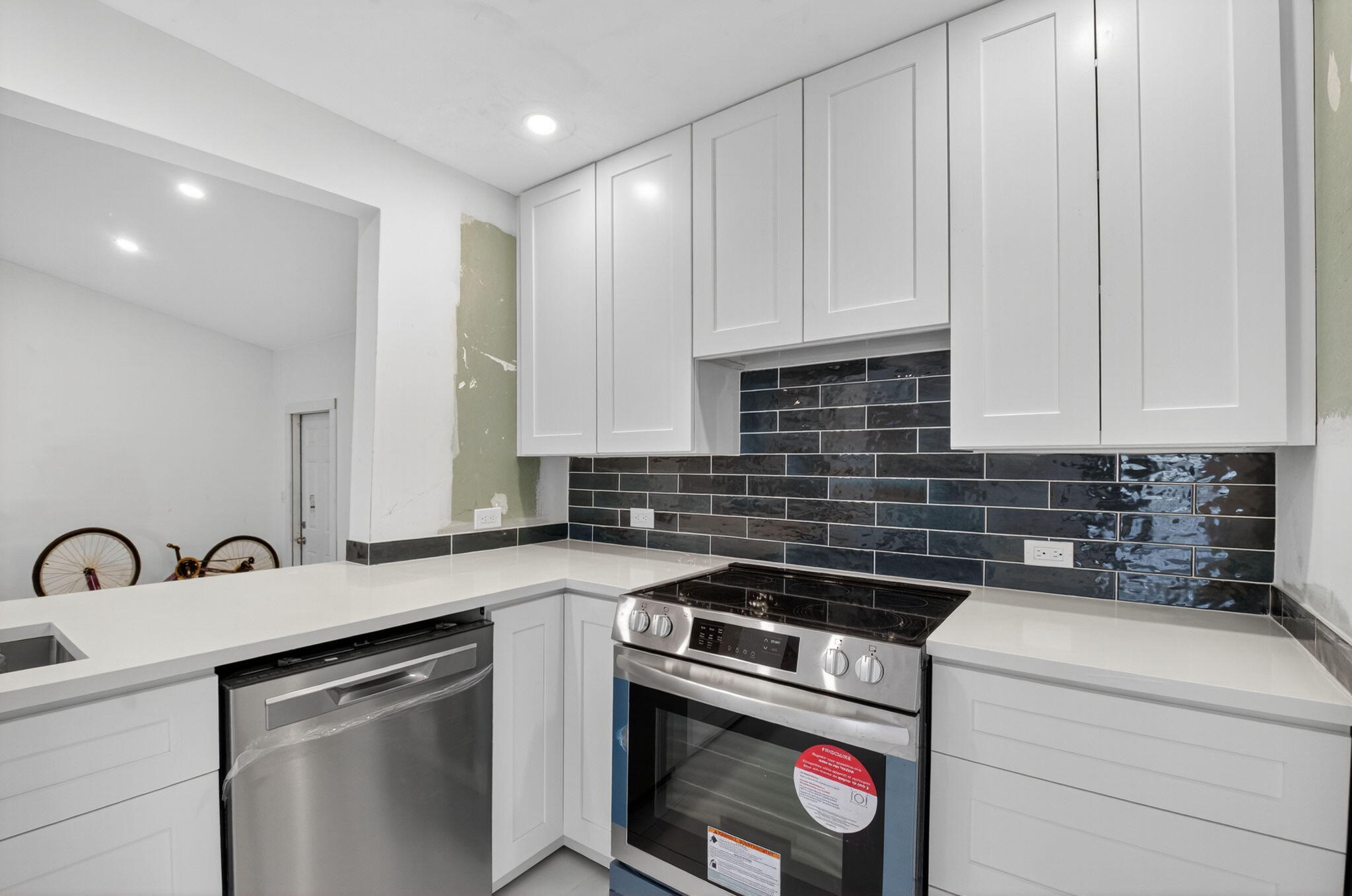 5196 Palm Ridge Boulevard Delray Beach, FL 33484 - Photo 7 of 24 a kitchen with a sink stove and cabinets