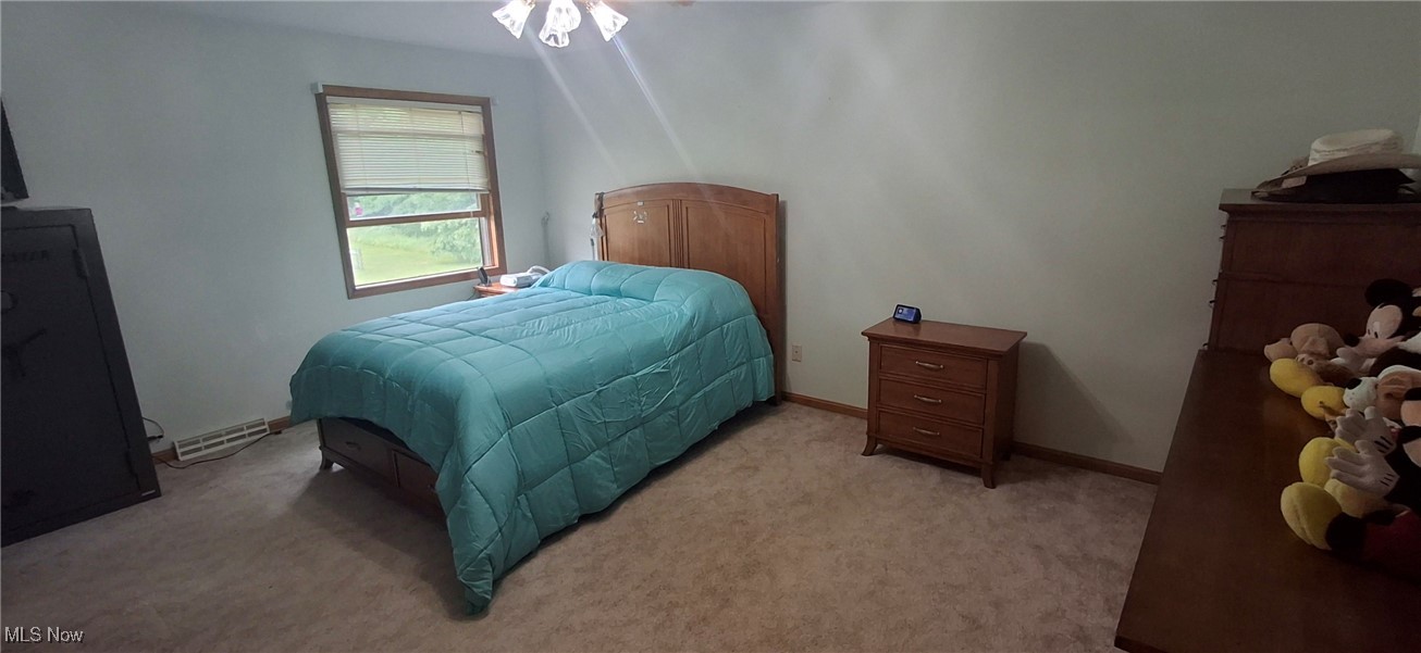 11737 Gladstone Road Warren, OH 44481 - Photo 16 of 41 Bedroom with light carpet and baseboards
