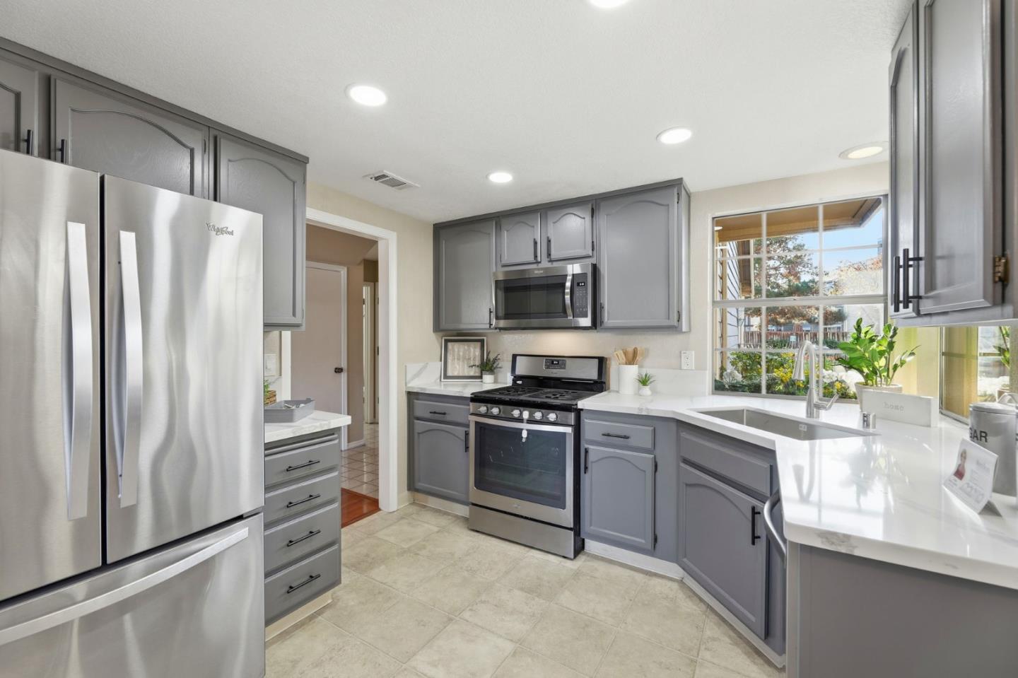 650 Folsom Circle Milpitas, CA 95035 - Photo 11 of 45 a kitchen with stainless steel appliances granite countertop a refrigerator stove and sink