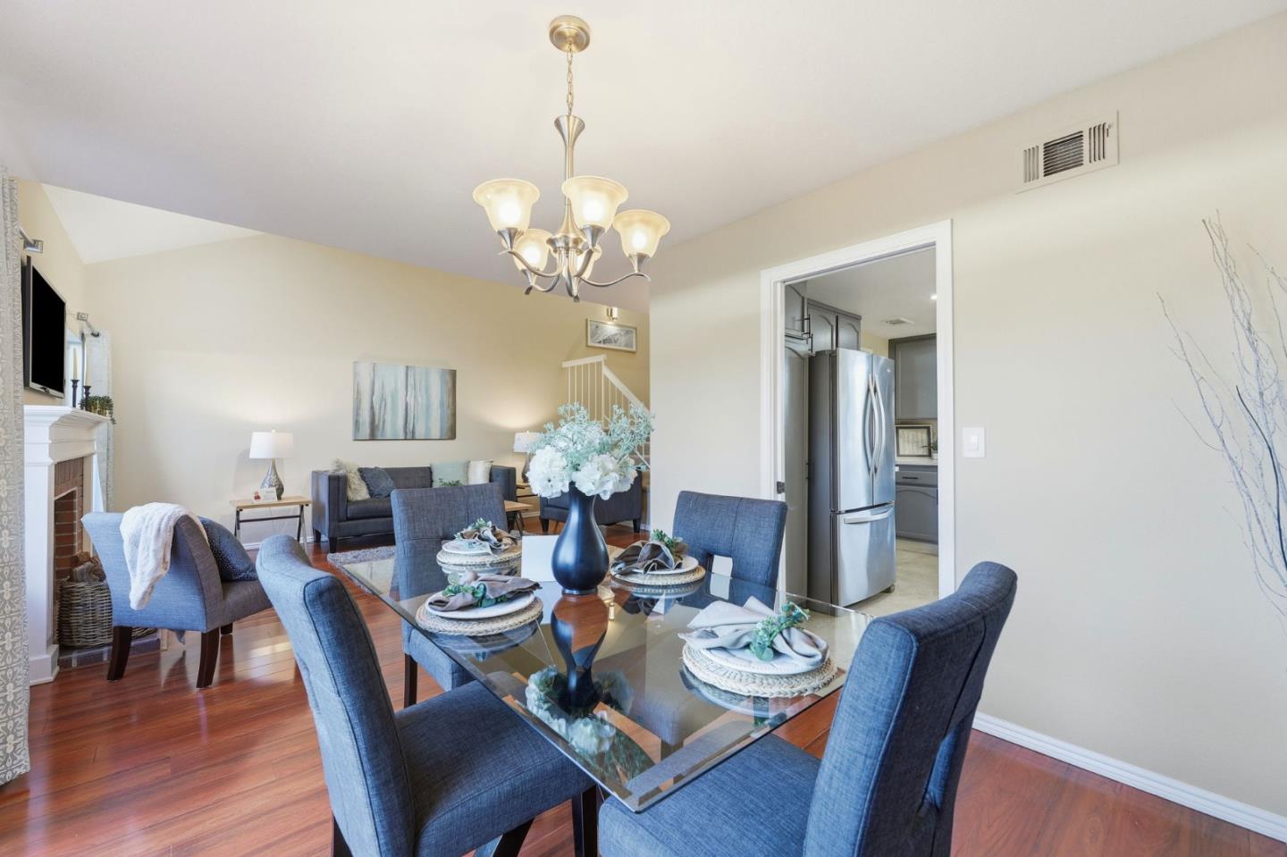 650 Folsom Circle Milpitas, CA 95035 - Photo 15 of 45 a view of a dining room with furniture wooden floor and chandelier