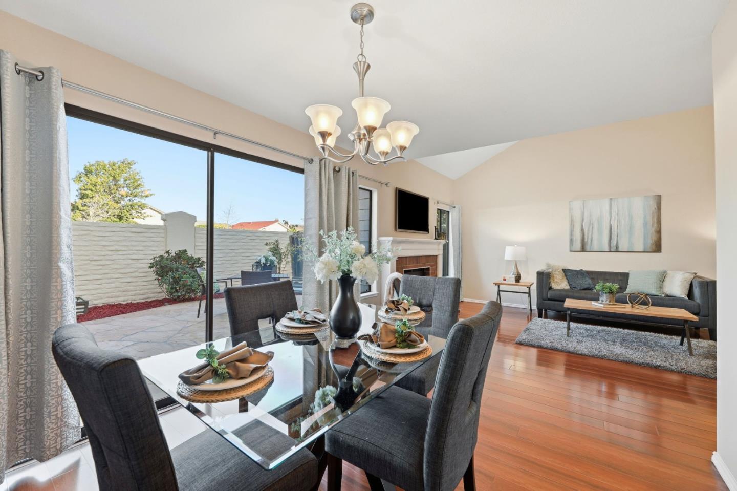 650 Folsom Circle Milpitas, CA 95035 - Photo 16 of 45 a dining room with furniture a large window and wooden floor