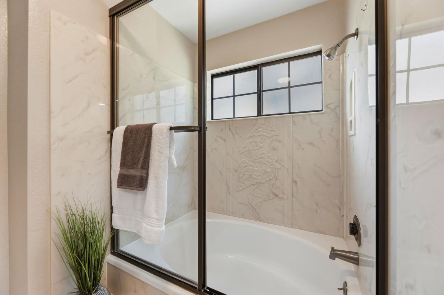650 Folsom Circle Milpitas, CA 95035 - Photo 26 of 45 a bathroom with a bathtub and a shower