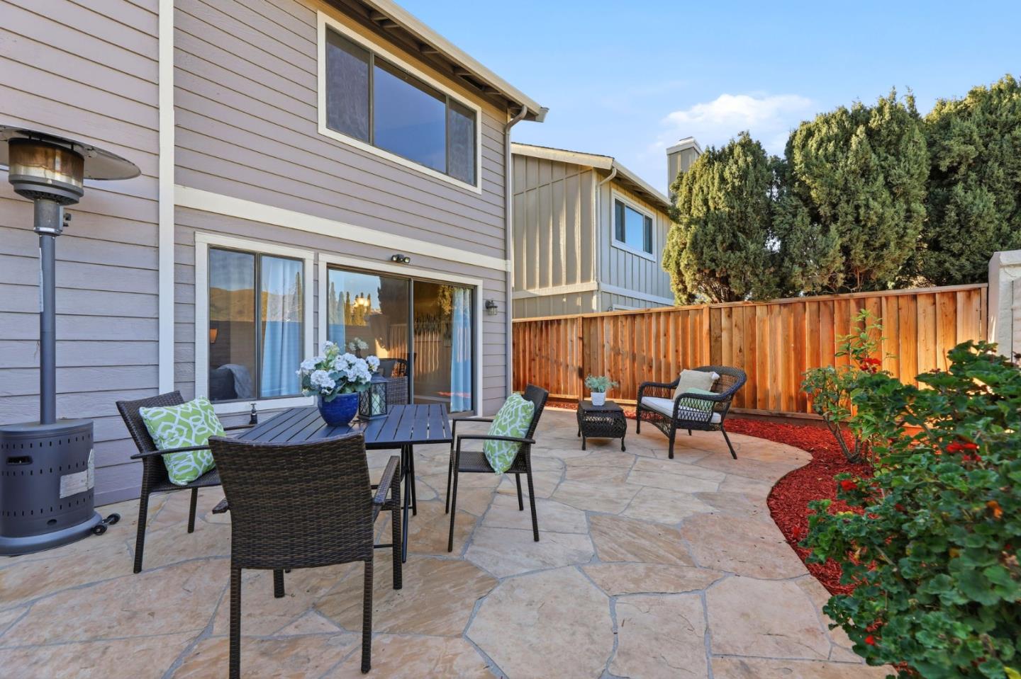 650 Folsom Circle Milpitas, CA 95035 - Photo 34 of 45 a view of a patio with table and chairs and potted plants