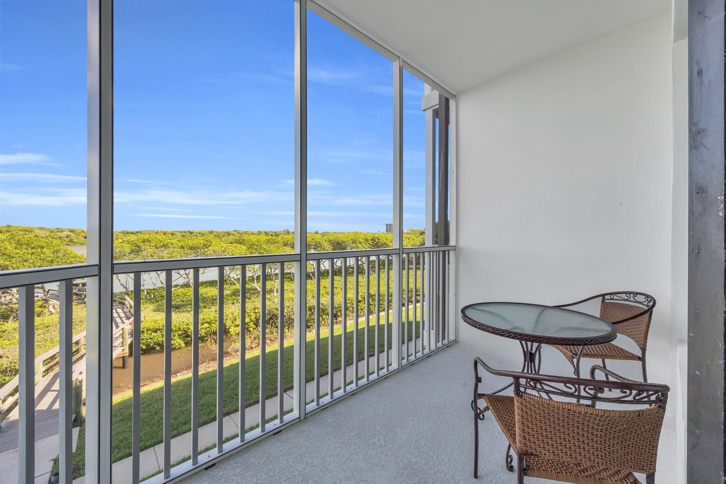 200 Waterway Road, Unit 206 Tequesta, FL 33469 - Photo 12 of 49 a view of a balcony with chair and table