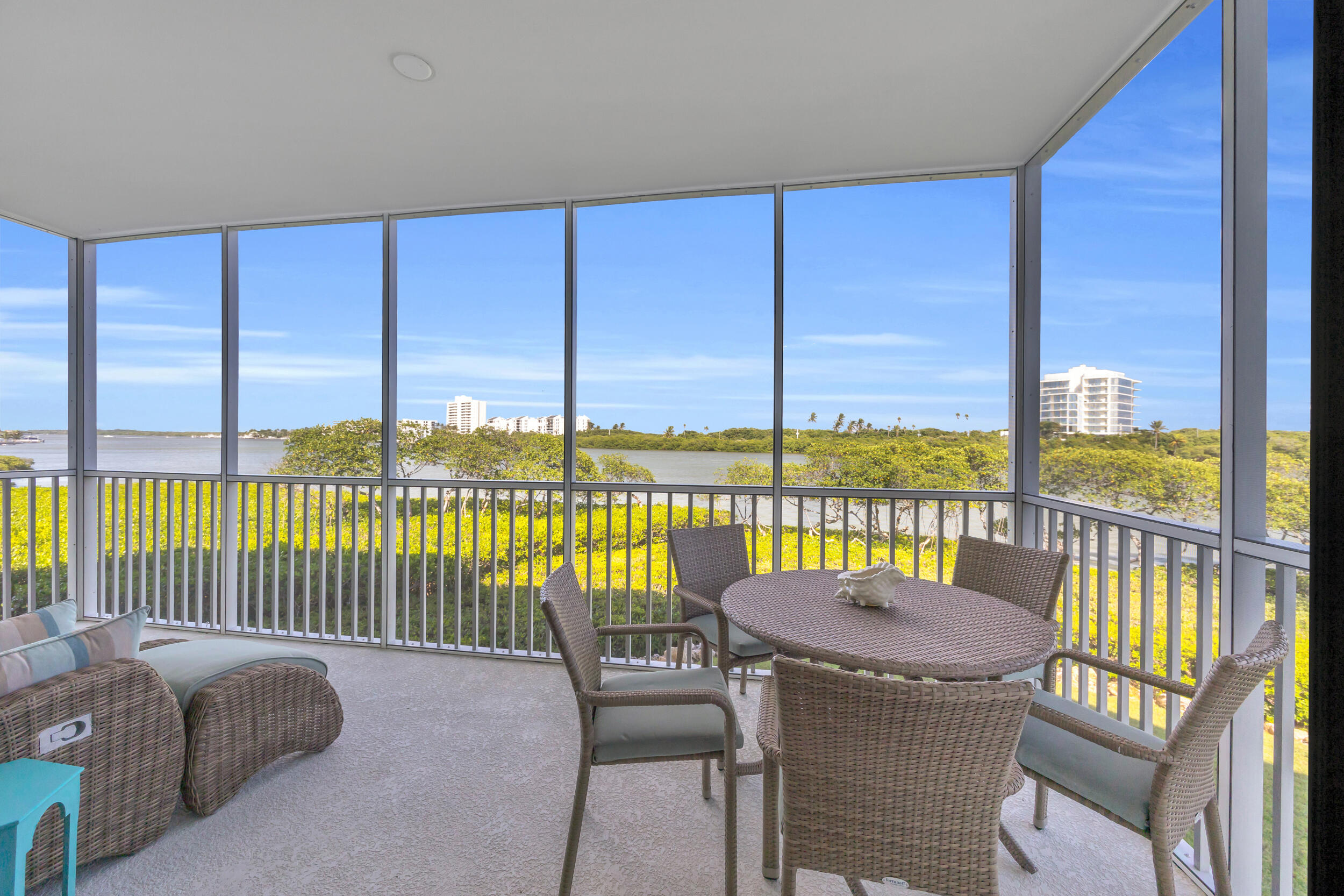 200 Waterway Road, Unit 206 Tequesta, FL 33469 - Photo 18 of 49 a view of a balcony with table and chairs