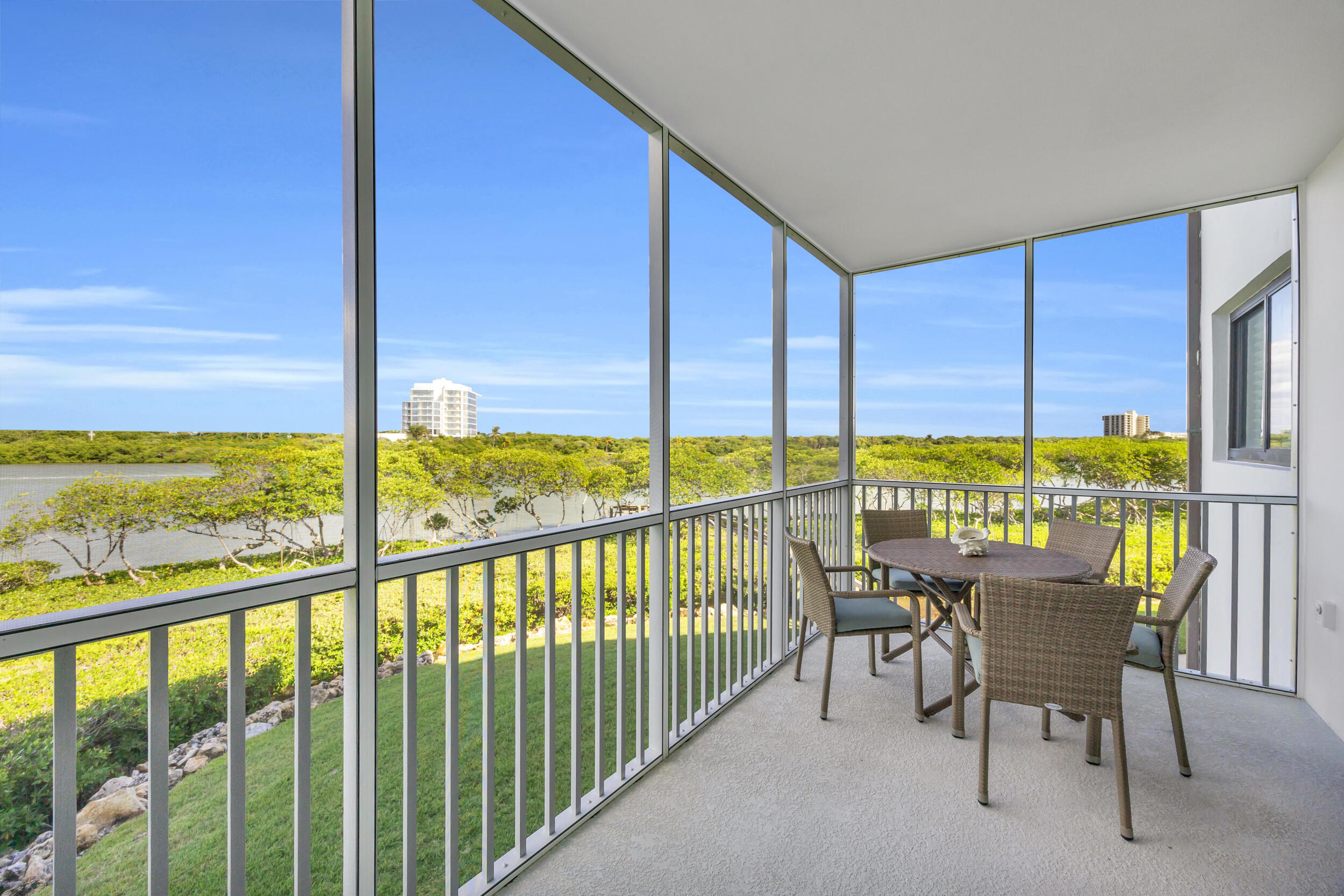 200 Waterway Road, Unit 206 Tequesta, FL 33469 - Photo 20 of 49 a view of a chairs and table in the balcony
