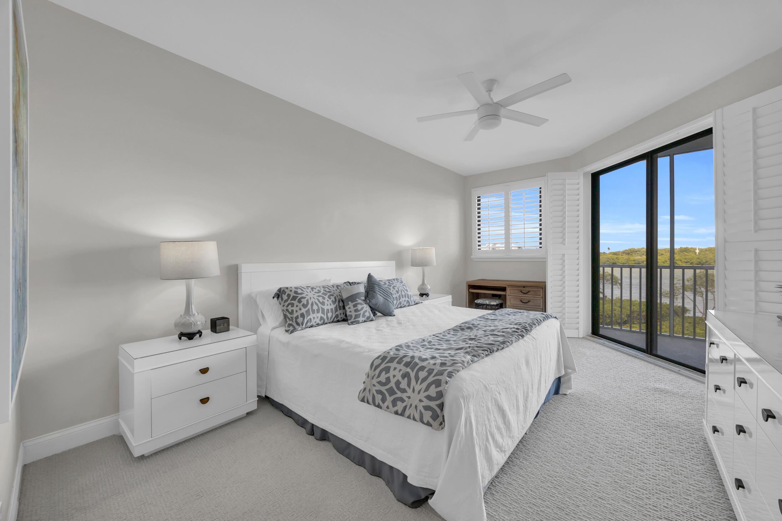 200 Waterway Road, Unit 206 Tequesta, FL 33469 - Photo 21 of 49 a bedroom with a bed and a large window