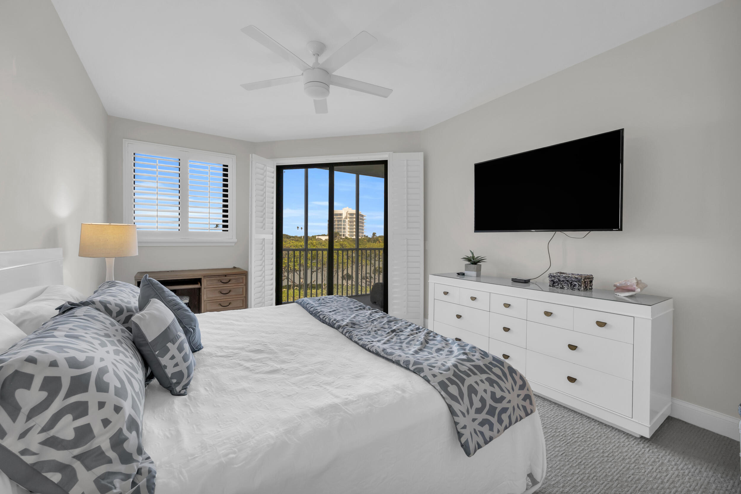 200 Waterway Road, Unit 206 Tequesta, FL 33469 - Photo 22 of 49 a bedroom with a large bed and a flat screen tv