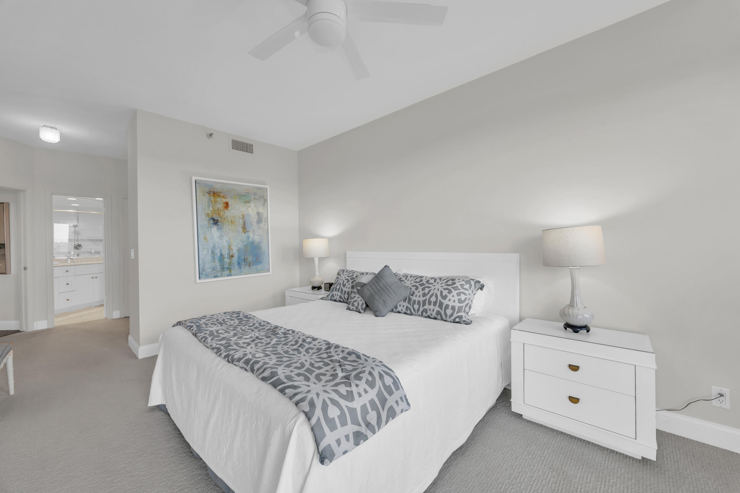 200 Waterway Road, Unit 206 Tequesta, FL 33469 - Photo 23 of 49 a bedroom with a bed and a night stand