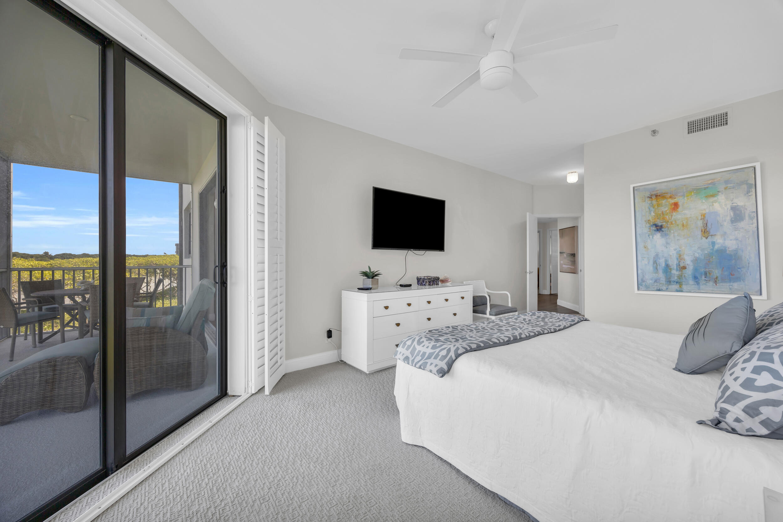 200 Waterway Road, Unit 206 Tequesta, FL 33469 - Photo 24 of 49 a room with a bed and a flat screen tv