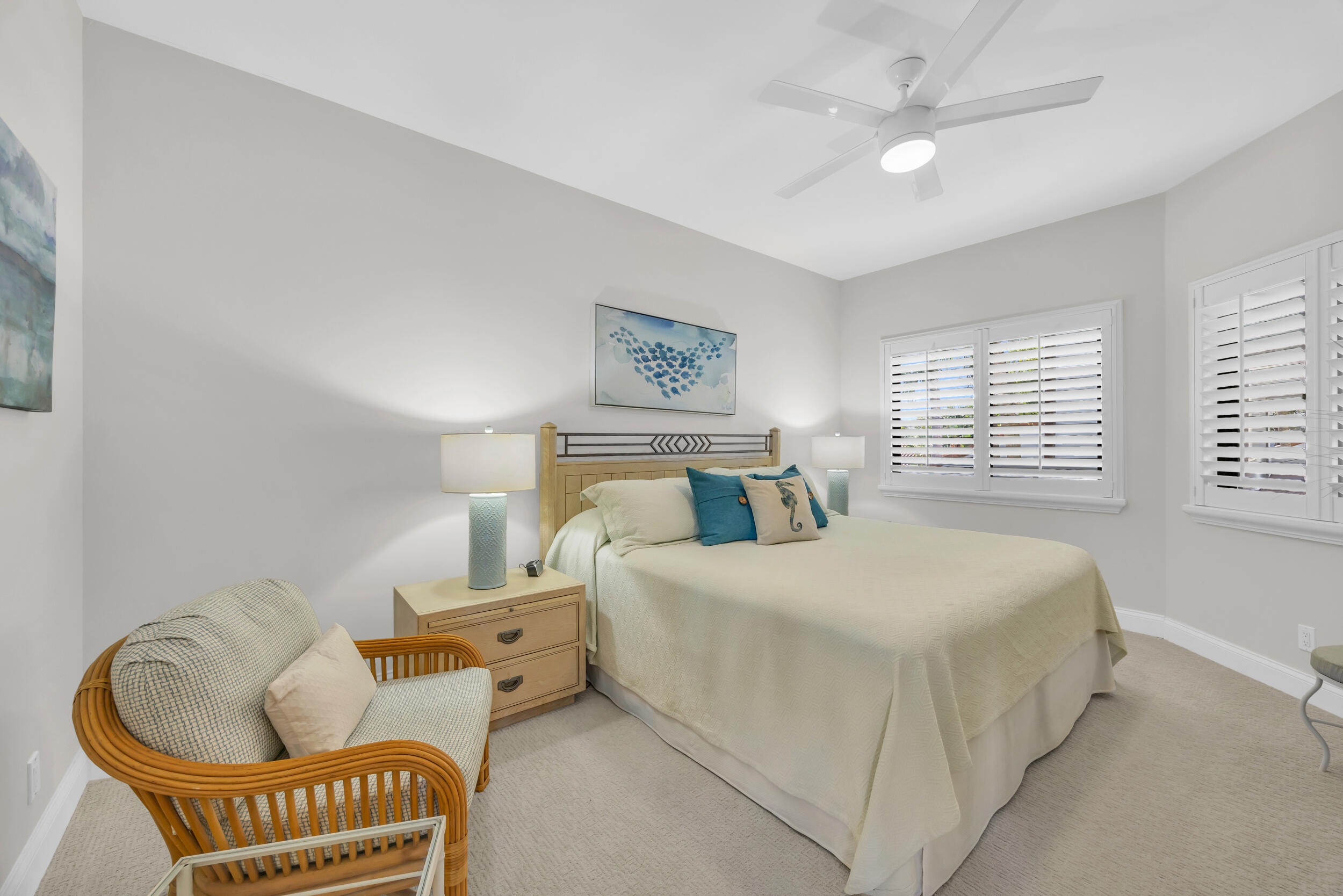 200 Waterway Road, Unit 206 Tequesta, FL 33469 - Photo 29 of 49 a spacious bedroom with a bed and a couch