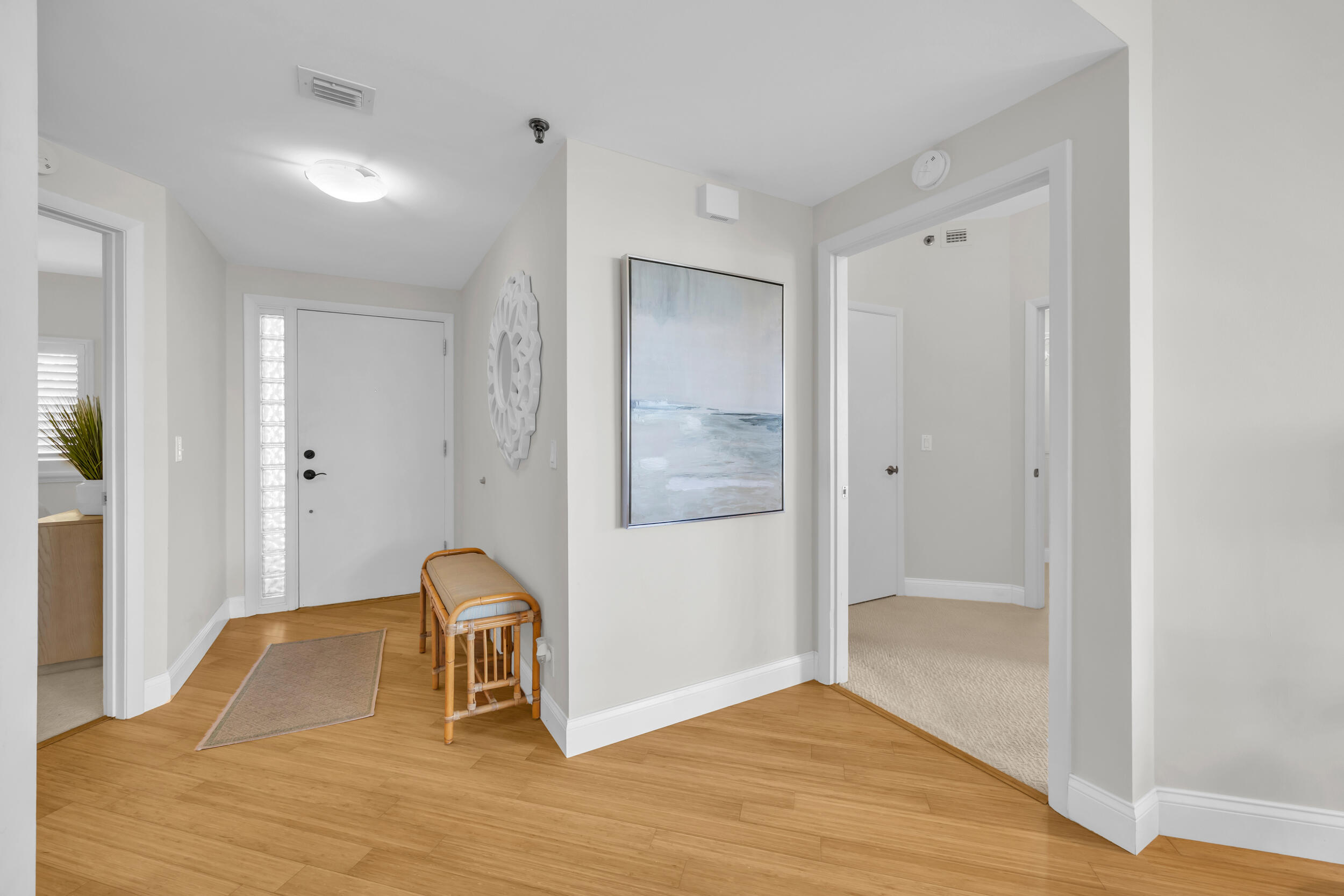 200 Waterway Road, Unit 206 Tequesta, FL 33469 - Photo 3 of 49 a room that has a bed and a mirror