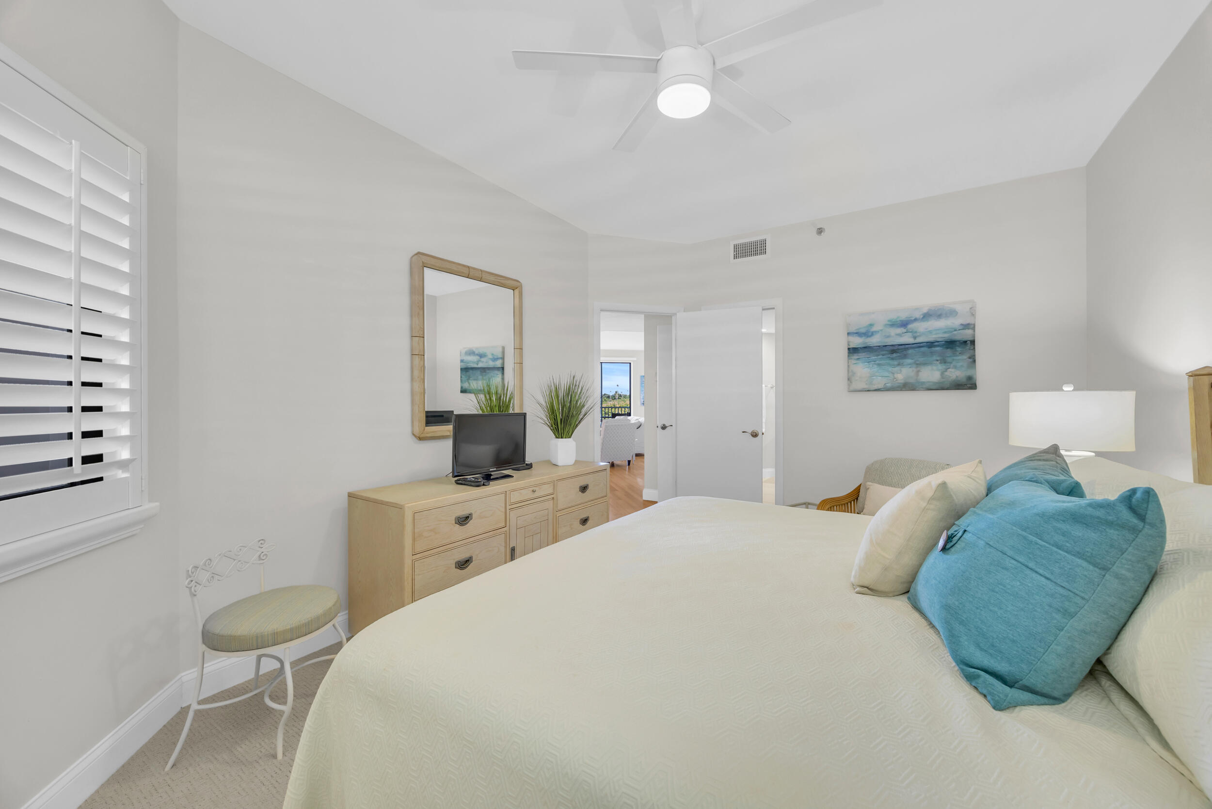 200 Waterway Road, Unit 206 Tequesta, FL 33469 - Photo 31 of 49 a bedroom with a bed and a cabinets