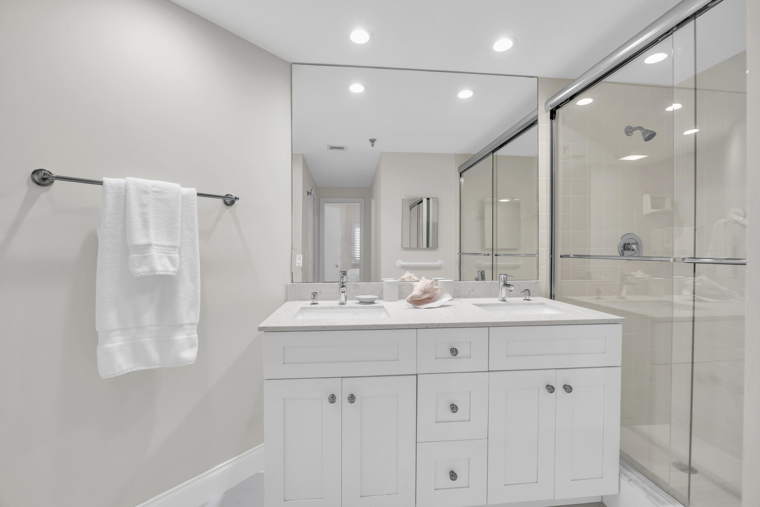 200 Waterway Road, Unit 206 Tequesta, FL 33469 - Photo 32 of 49 a bathroom with double sink and a mirror