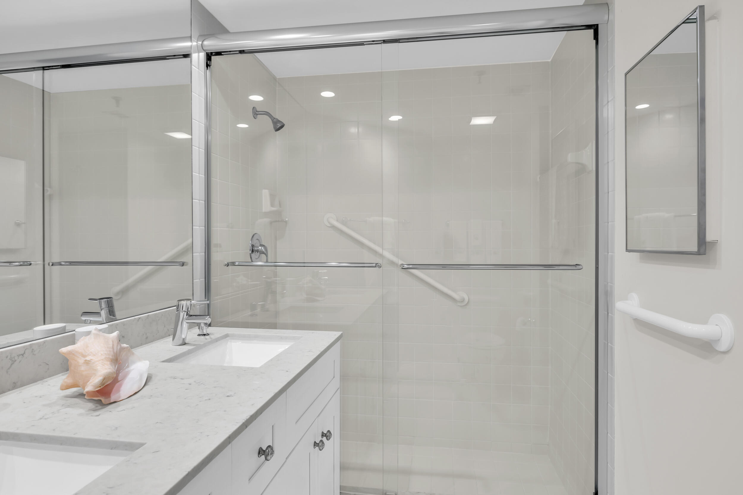 200 Waterway Road, Unit 206 Tequesta, FL 33469 - Photo 33 of 49 a bathroom with a sink shower and a mirror