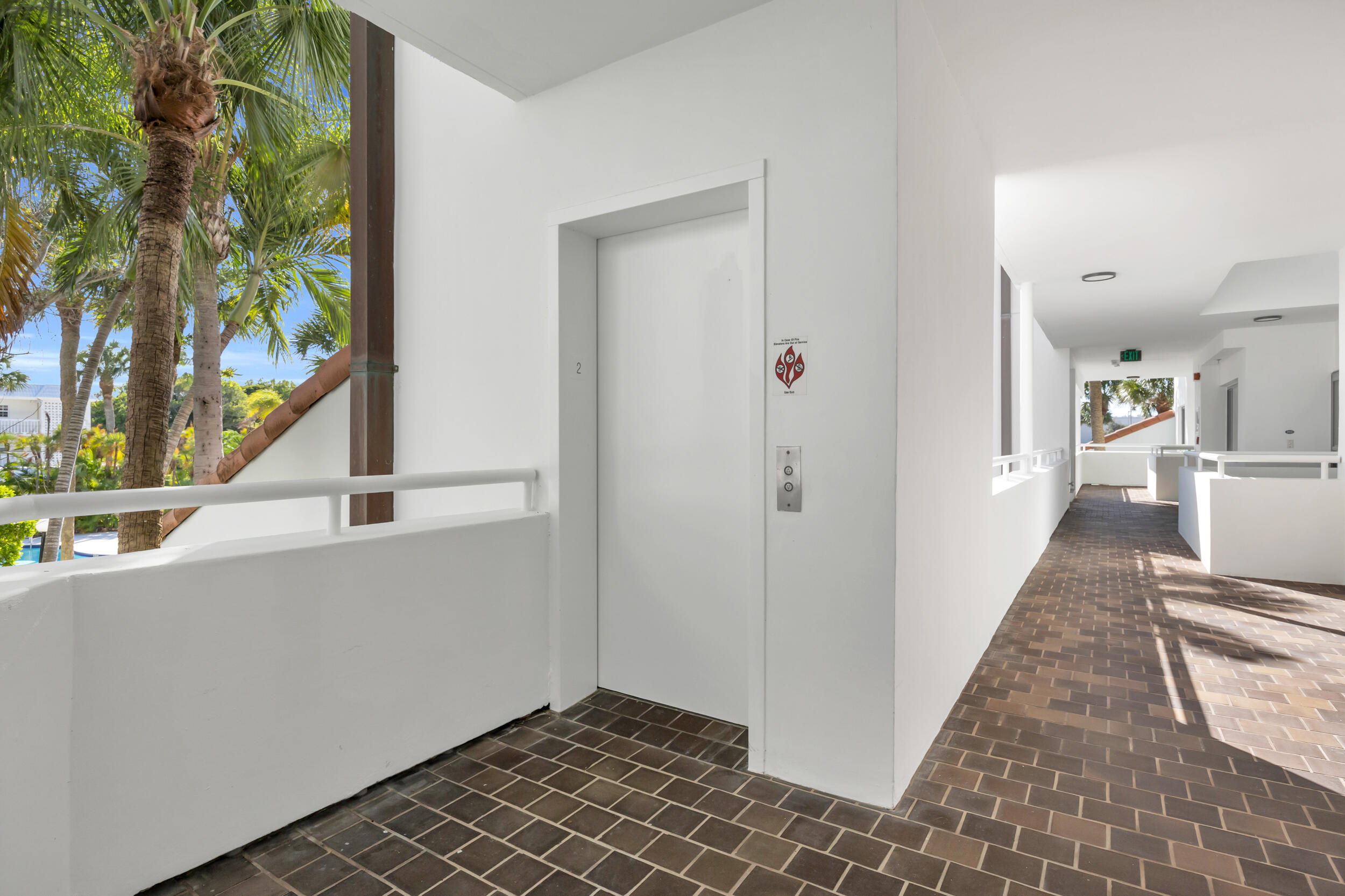 200 Waterway Road, Unit 206 Tequesta, FL 33469 - Photo 35 of 49 a view of a hallway with wooden floor and staircase