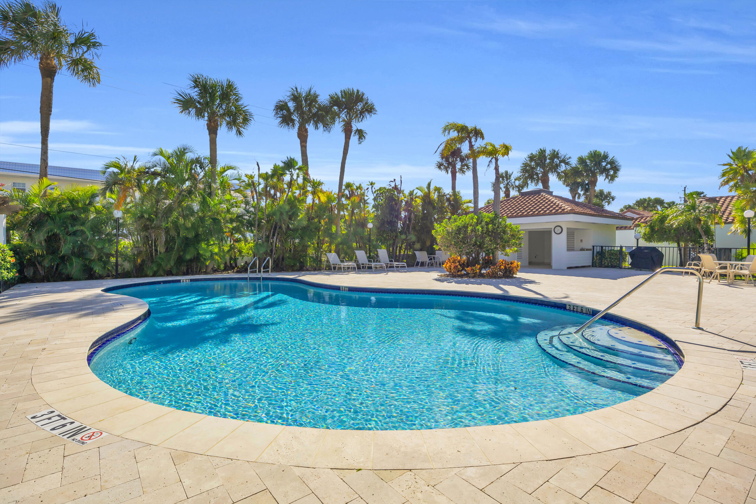 200 Waterway Road, Unit 206 Tequesta, FL 33469 - Photo 37 of 49 a view of a swimming pool with a yard