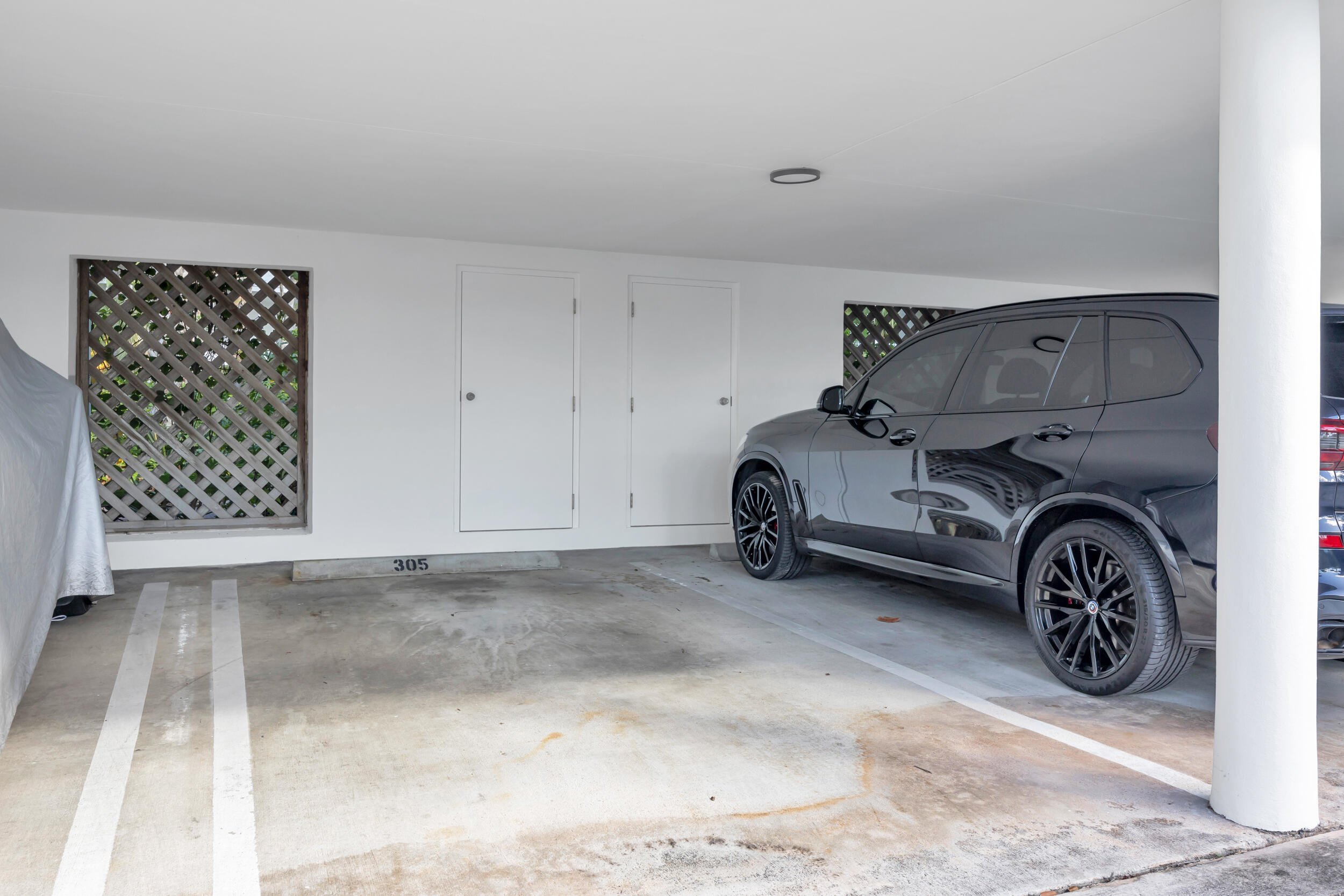 200 Waterway Road, Unit 206 Tequesta, FL 33469 - Photo 39 of 49 a car parked in garage