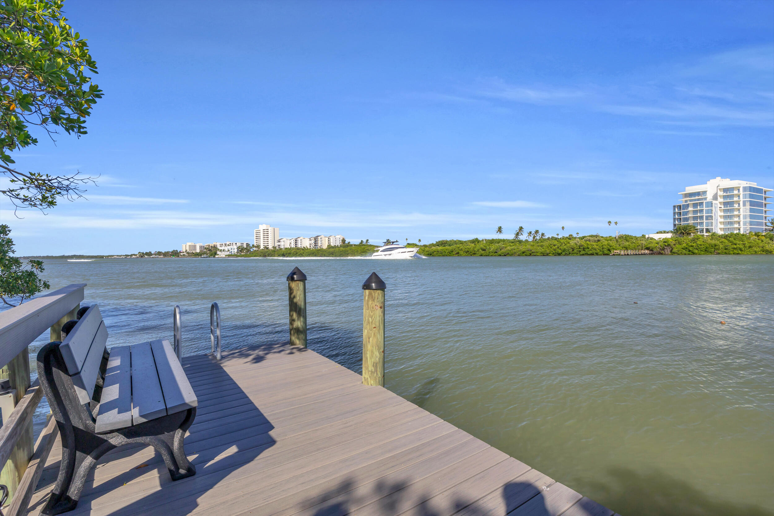 200 Waterway Road, Unit 206 Tequesta, FL 33469 - Photo 41 of 49 a view of a lake with a city skyline in the background