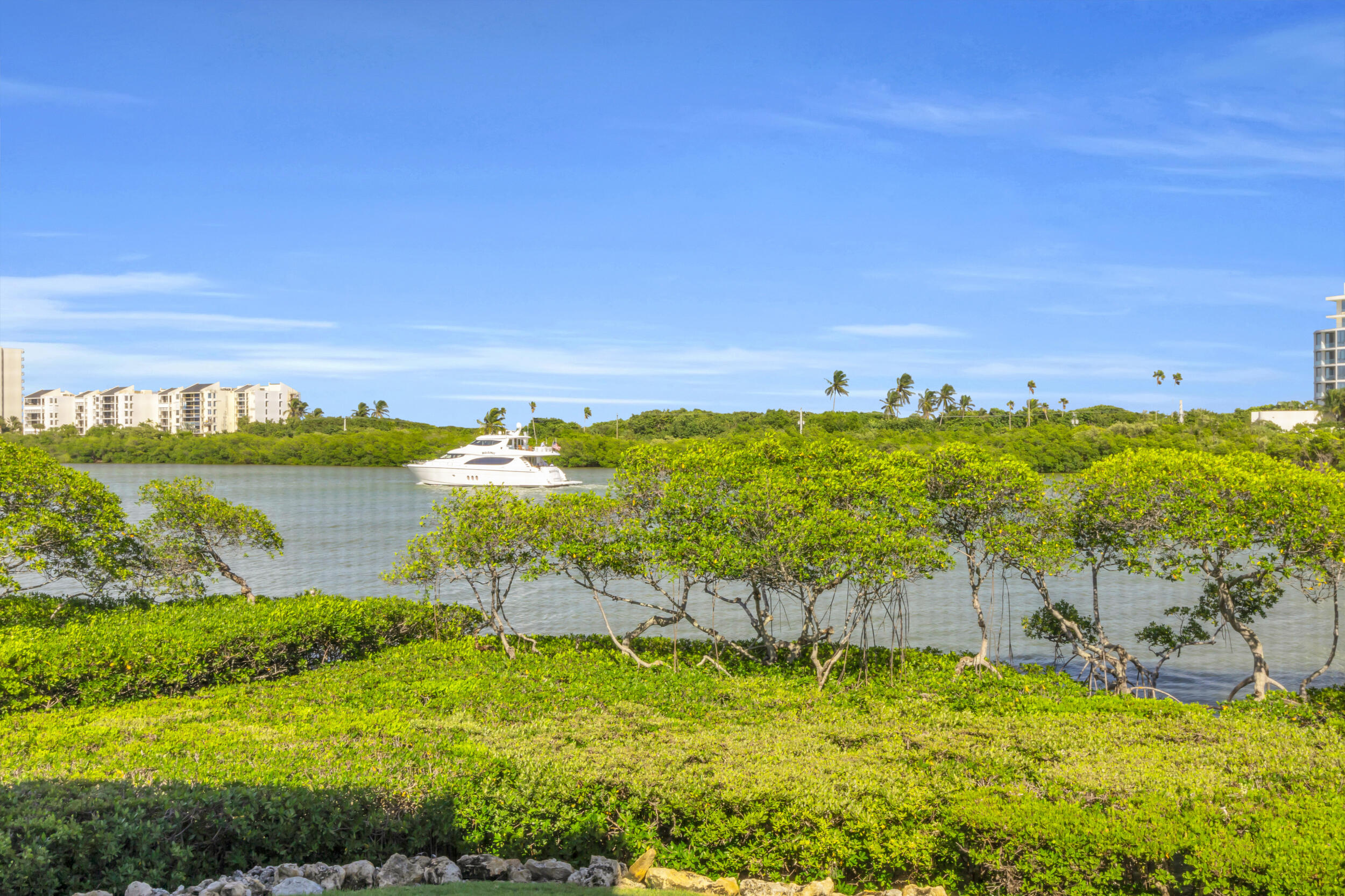 200 Waterway Road, Unit 206 Tequesta, FL 33469 - Photo 43 of 49 a view of a lake with houses in the back