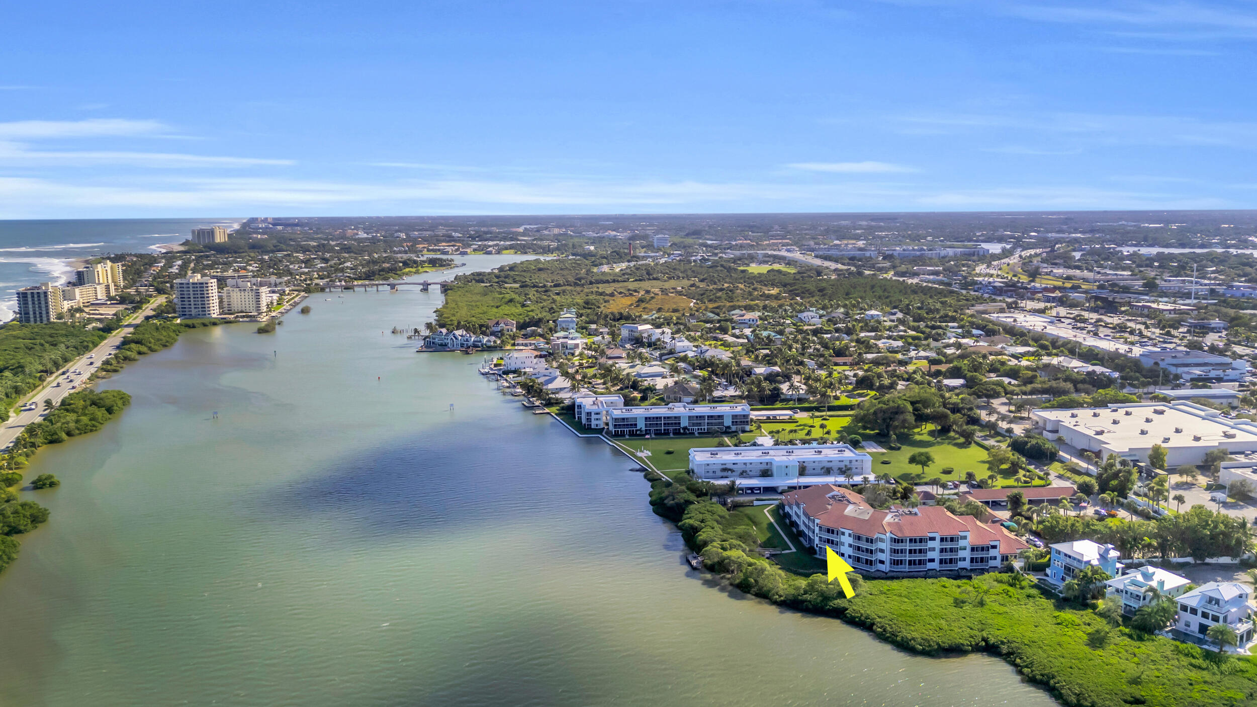 200 Waterway Road, Unit 206 Tequesta, FL 33469 - Photo 49 of 49 an aerial view of a city with lots of residential buildings ocean and mountain view in back