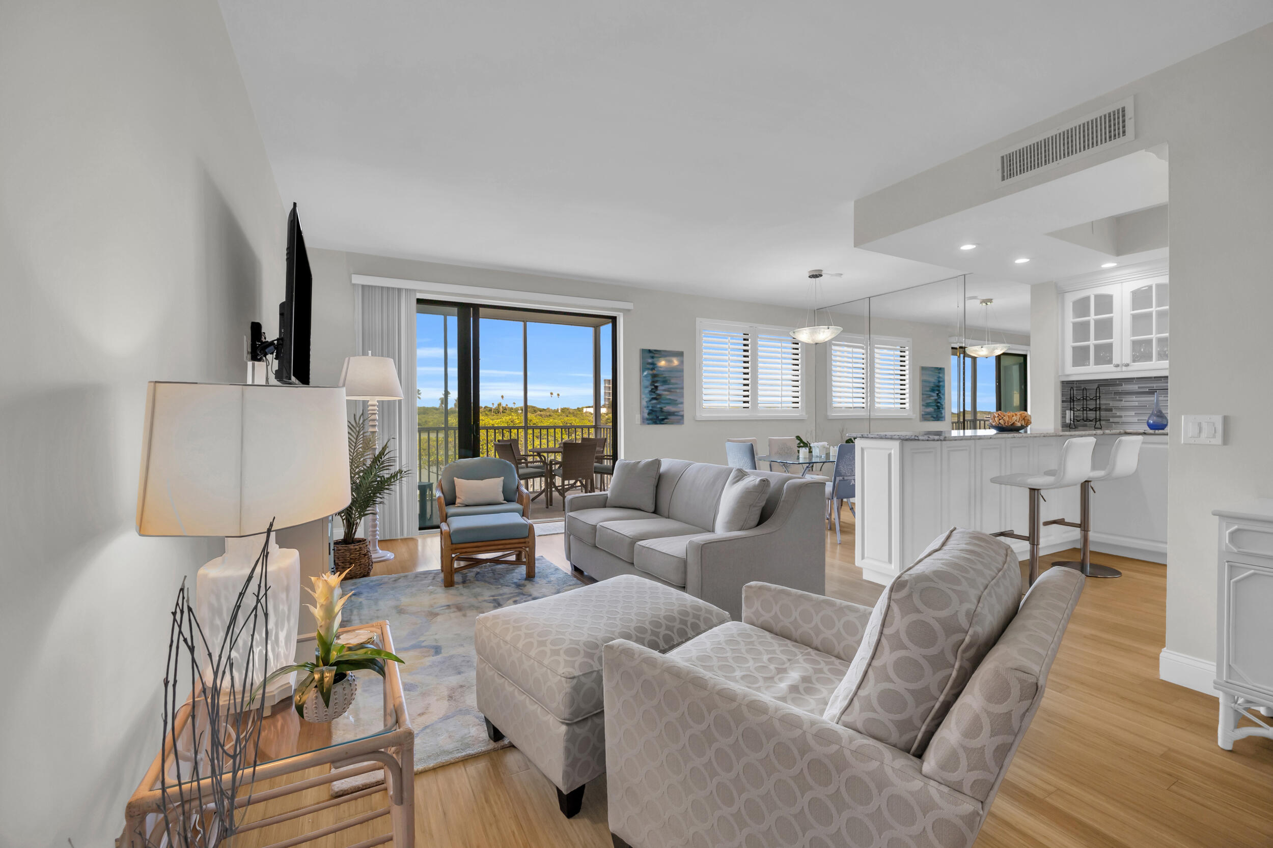 200 Waterway Road, Unit 206 Tequesta, FL 33469 - Photo 5 of 49 a living room with furniture and a wooden floor