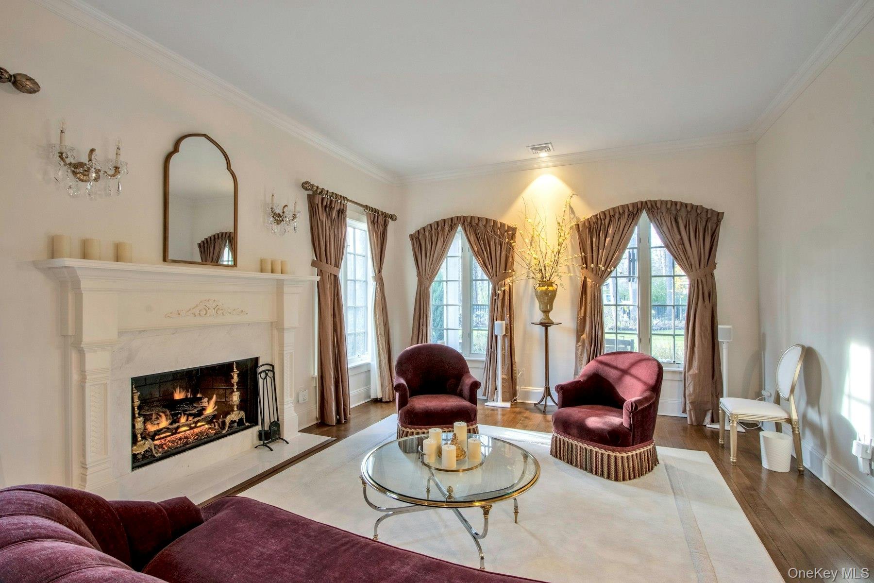 129 Washington Spring Road Palisades, NY 10964 - Photo 4 of 44 Living room featuring hardwood / wood-style flooring, crown molding, and a high end fireplace