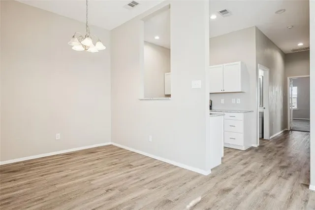 a view of a kitchen with wooden floor