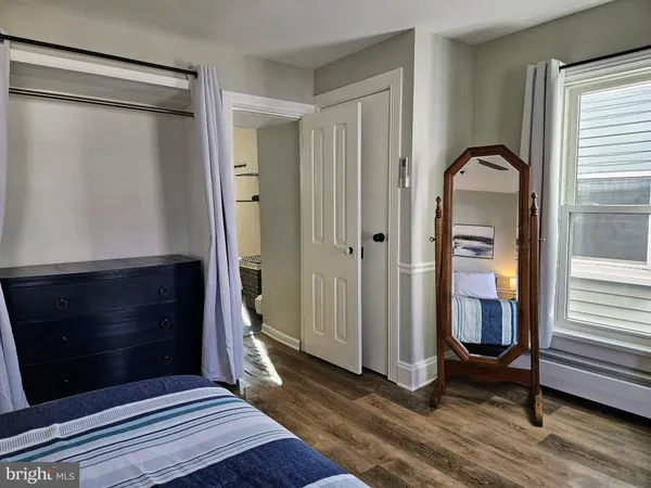 a bedroom with a door and a window
