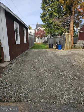 a view of a house with a yard and garage