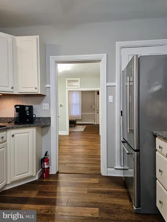 a view of a kitchen from the hallway