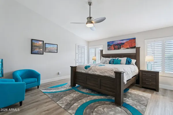 a bedroom with a bed and a couch