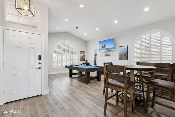 a living room with furniture a window and a table